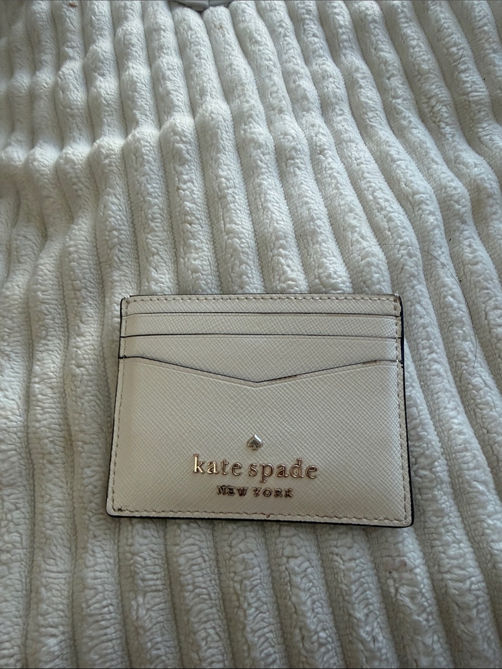 kate spade cream leather card case with gold logo